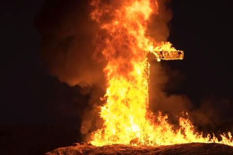 Burning Cross at night Stock Photos