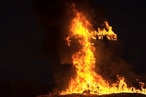 Burning Cross at night Stock Photos