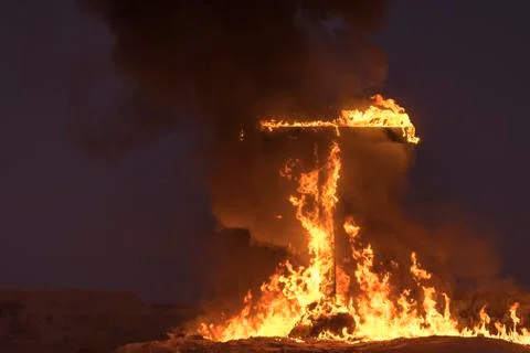 Burning Cross at night Stock Photos
