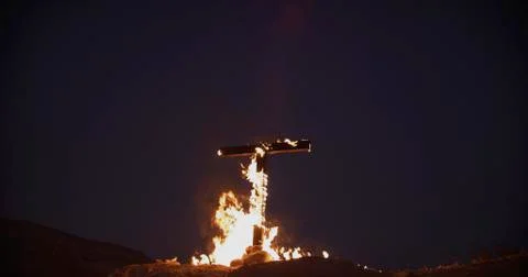 Burning Cross at night Stock Photos