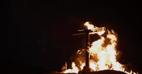 Burning Cross at night Stock Photos