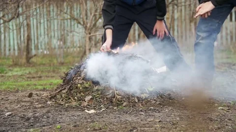 Burning Debris, Leaves, Small Trees and Weeds in the Garden on own Plot. Slow Vídeos de archivo 73947104