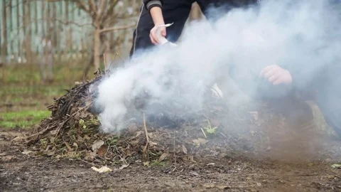 Burning Debris, Leaves, Small Trees and Weeds in the Garden on own Plot. Slow Vídeos de archivo 74058691