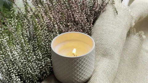 A burning decorative candle in a ceramic jar Stock-Footage 164746640