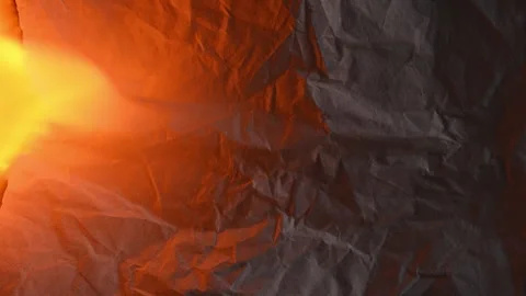 Burning document symbolizing conflict escalation and crisis 库存影片 331943138