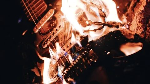 Burning electric guitar. Close-up of a burning guitar. Beautiful moment Stock Footage 114519637