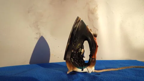 Burning Electric kettle. Electric kettle for tea caught on fire over table Stock Footage 286325133