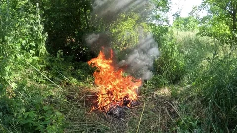Burning Electrical Wires In Bonfire With Toxic Black Smoke Close Up Environm Stock Footage 337796339