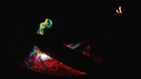Burning embers and blue flame against night darkness Stock Footage 335072202