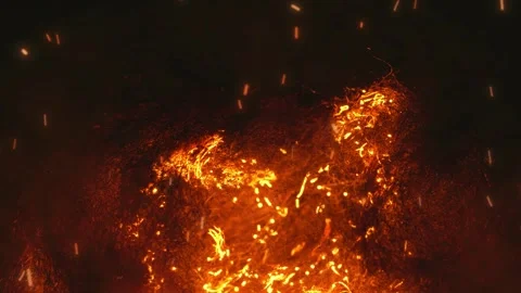 Burning embers and sparks float upwards in dark background motion Stock Footage 327517819