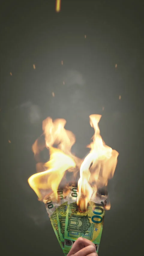 Burning Euro banknotes held in hand Video stock 303142979