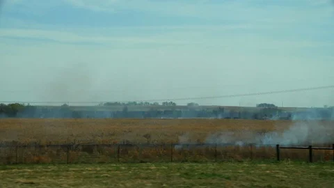 Burning Fields While Driving on American Highway Stock-Footage 128755993