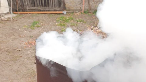 Burning fire and smoke in a garbage barrel Stock Footage 130077782