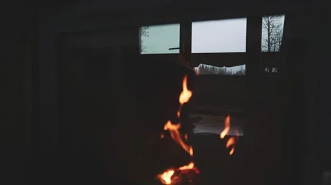 Burning Fire and Window Reflection in a Fireplace Protection Glass. 4K. Stock Footage 66734355