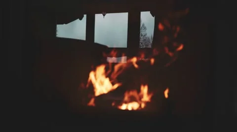 Burning Fire and Window Reflection in a Fireplace Protection Glass. 4K. 動画素材 66734404