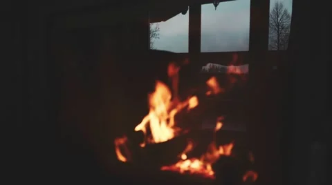 Burning Fire and Window Reflection in a Fireplace Protection Glass. 4K. 動画素材 66734513