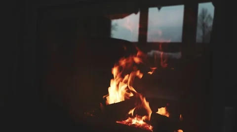 Burning Fire and Window Reflection in a Fireplace Protection Glass. 4K. Stock Footage 66734520