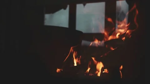 Burning Fire and Window Reflection in a Fireplace Protection Glass. 4K. Stock Footage 66734794
