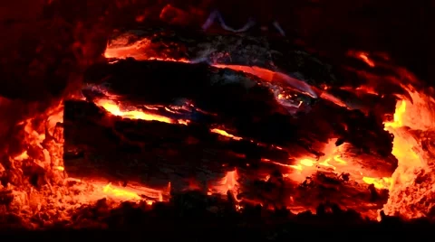 Burning fire in the fireplace, Burning and glowing pieces of wood in Fireplace Stock Footage 62465343