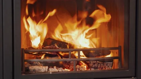 Burning fire in the fireplace. Close-up fireplace with medium size flames. Stock Footage 143584883