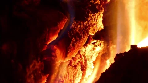 A burning fire in a fireplace, in the middle of the cold autumn Stock Footage 292932898