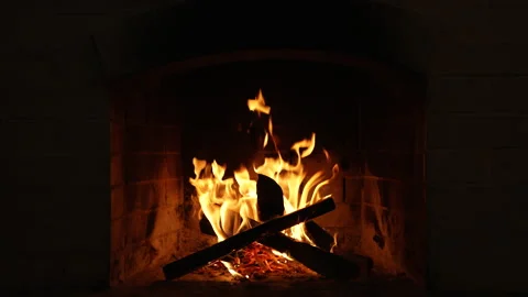 Burning Fire In The Fireplace. Slow motion. A looping clip of a fireplace with Stock-Footage 166516633