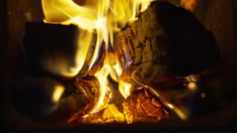 A burning fire with firewood in the dark. Video stock 146514084