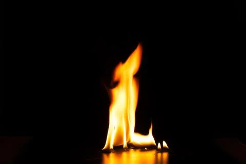 Burning fire flame on black background Stock Photos