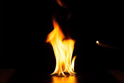 Burning fire flame on black background Stock Photos