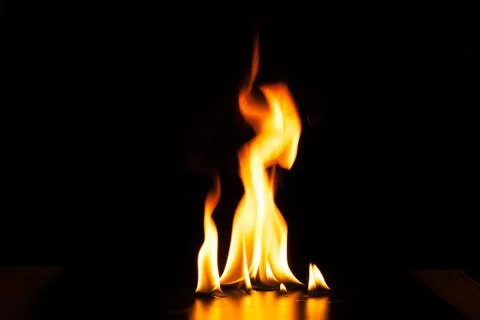 Burning fire flame on black background Stock Photos