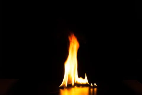 Burning fire flame on black background Stock Photos