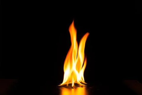 Burning fire flame on black background Stock Photos