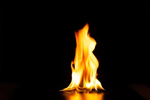 Burning fire flame on black background Stock Photos