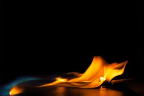 Burning fire flame on black background Stock Photos