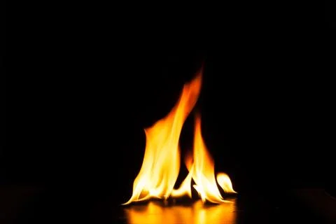Burning fire flame on black background Stock Photos