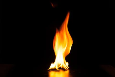 Burning fire flame on black background Stock Photos