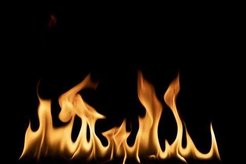 Burning fire flames and hot blaze line on black background. use this isolat.. Foto stock