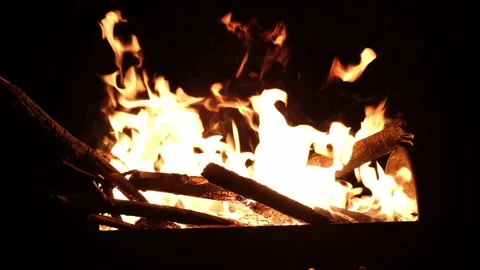 Burning fire in the grill close up. Campfire flames on a dark or black Stock Footage 159390599