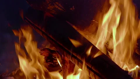 Burning fire of large logs on an autumn evening.  Slow motion - Close-up camp Stock Footage 162515232