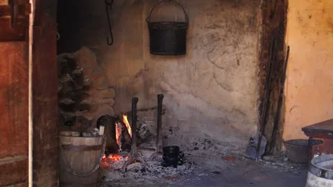 Burning fire in a large open hearth in a rustic kitchen Stock Footage 151567294