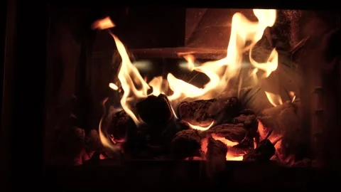 Burning fire logs inside stone fireplace. Close-up view. 스톡 동영상 275076895
