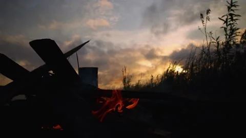 Burning fire at night against the backdrop of sunset, screensaver Stock Footage 169652289