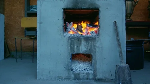 Burning fire in old-fashioned traditional Ukrainian stove. Stock Footage 104906003