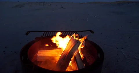 Burning fire in a portable barbecue at the beach Stock Footage 150199672