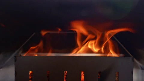 Burning fire in slow motion in a modern metal pizza oven. 库存影片 238727836