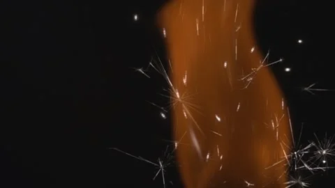 Burning fire sparks on a dark background. Stock Footage 149832728