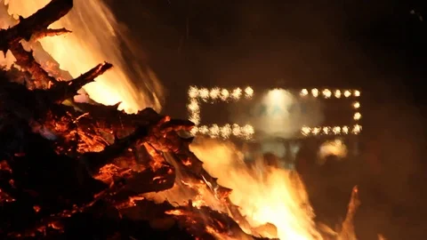 Burning fire with vendors in back Stock Footage 122802420