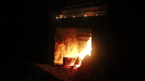 Burning fireplace in full darkness Stock Footage 157309262
