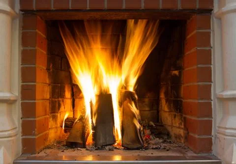 Burning fireplace Stock Photos