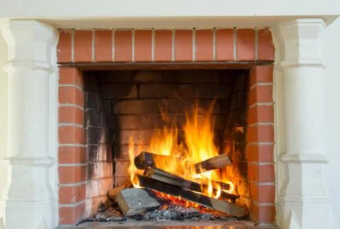 Burning fireplace. Stock Photos